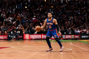Basketball point guard bringing the ball up court